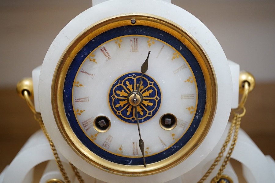 A late 19th century French ormolu mantel clock and another clock in an alabaster case, 39cm. Condition - fair to good